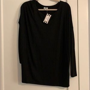 Large black piko shirt. Never worn.